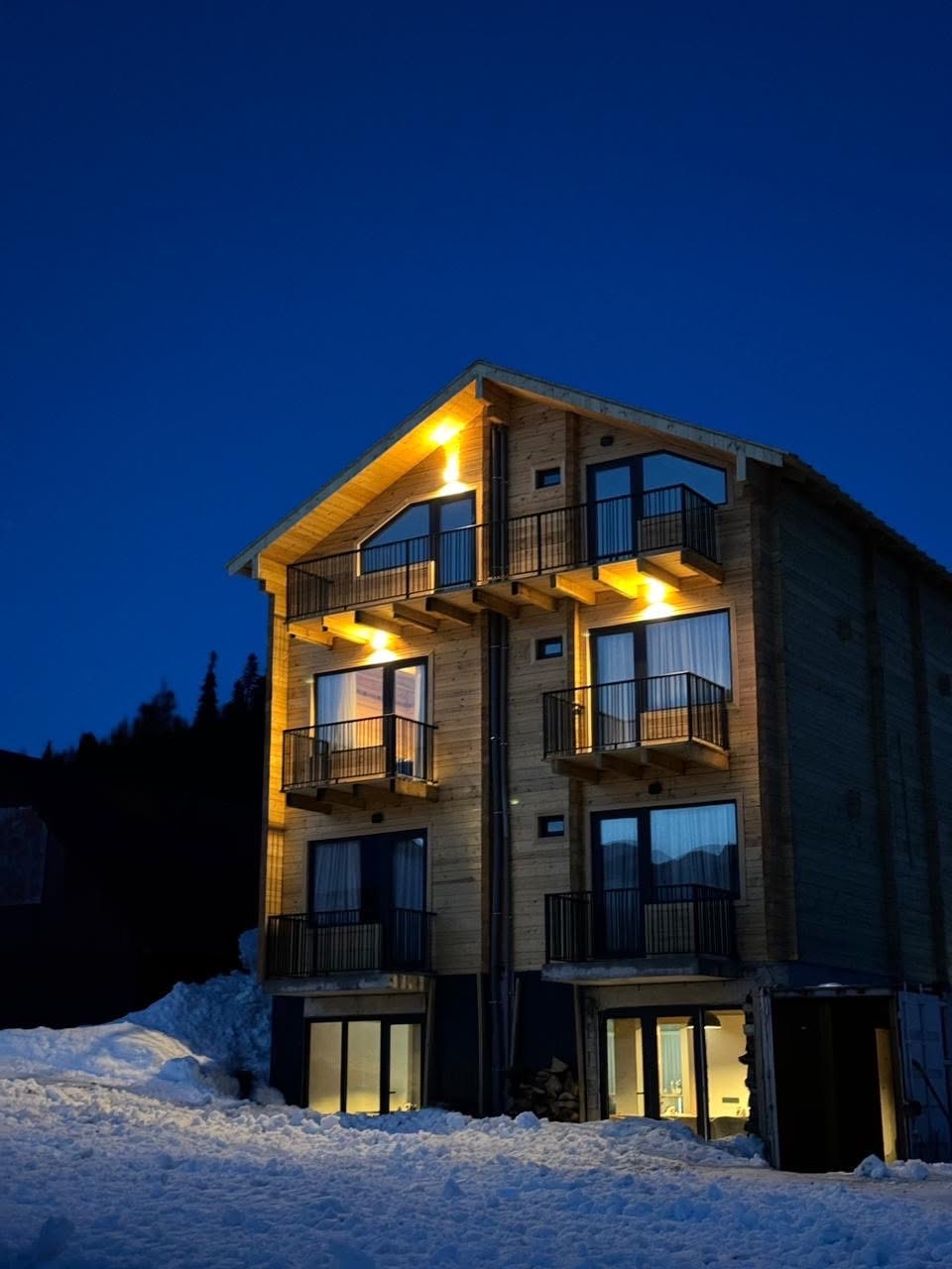 ALMORI wooden house at night
